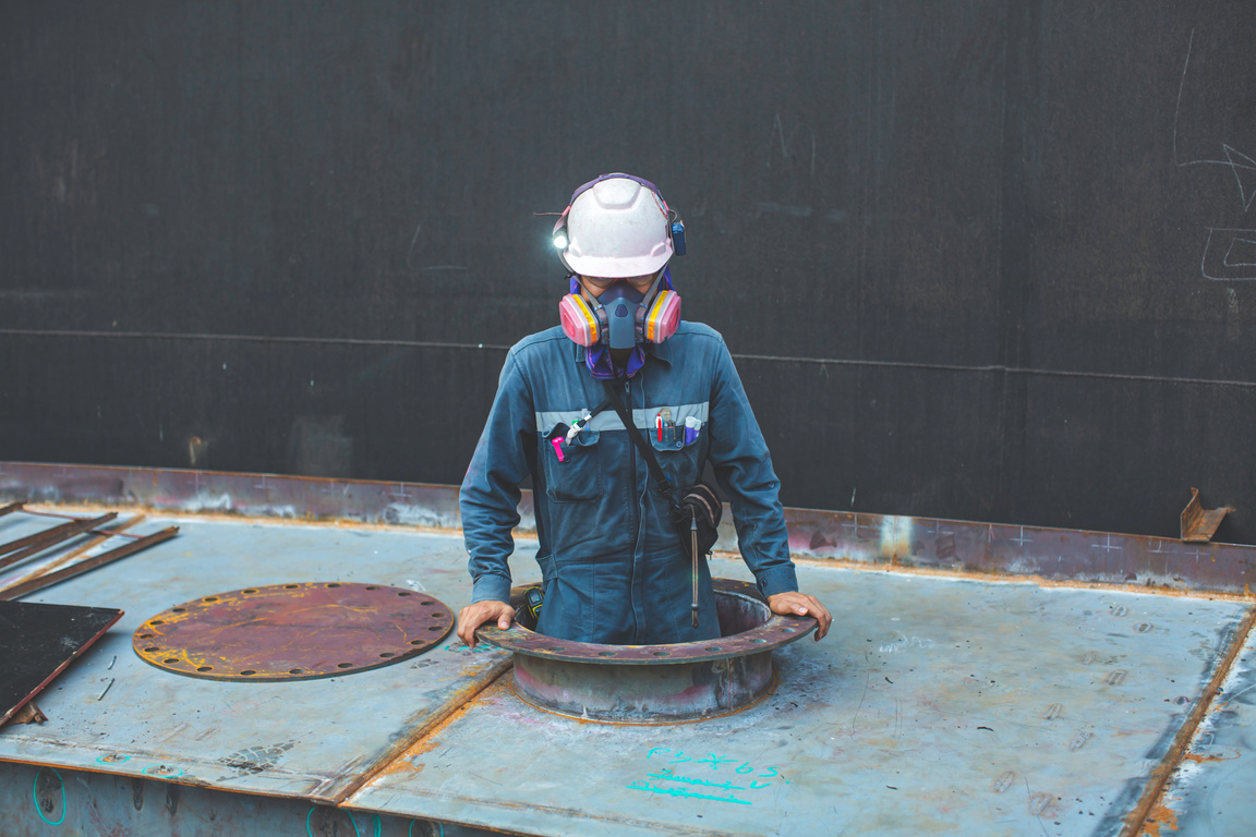 Male worker inside the pontoon tank storage visual inspection ta